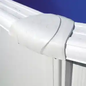 Close-up of a white plastic end cap on a metal panel rail with a blue sky behind.